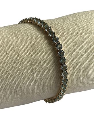 une image représentant un bracelet en or et en cristaux bleus