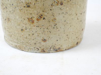 a close up of a cup on a white surface