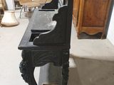 a black table with a mirror on it in a room