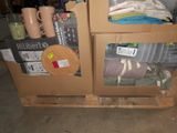 two boxes with items in them sitting on a pallet