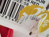 a label that says style basic visor on a red shirt