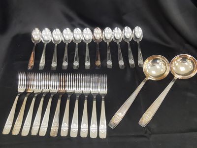 a group of silverware including spoons, forks and spoons