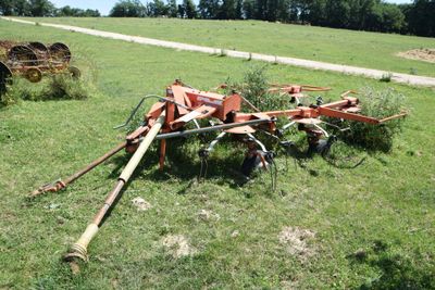 an image of a tractor and a plow in a field