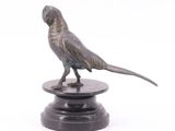 statue of a bird on a pedestal on a white background
