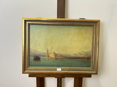 a picture of a painting on a easel in a room