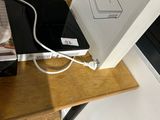 a laptop computer sitting on top of a wooden desk