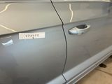 a silver car with a sticker on the side of it