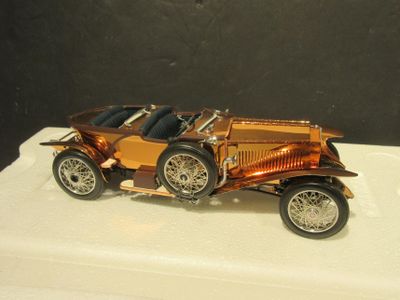 a small model of a car on display on a table