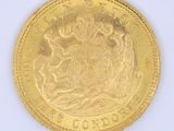 an image of a gold coin with the image of a man and woman on it