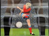 a poster of a soccer player kicking a soccer ball