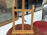 a wooden easer sitting on top of a wooden table