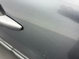 a close up of a car door handle with a sticker on it