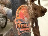a close up of a bike with a sticker on it