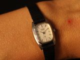 a small red spot on the wrist of a person