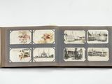 an open book with pictures on it on a white surface