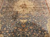 an image of a large oriental rug on a wooden floor