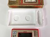 an image of a nintendo game console with a box on top of it