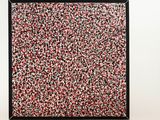 a black frame with a red, white and black painting on it