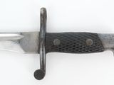 a close up of a knife on a white surface