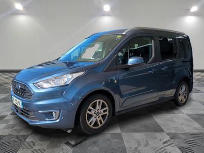 a blue ford transit van parked on a checkered floor