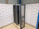 a close up of a metal rack in a room with a wall of blue and white signs