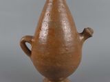 an image of a brown vase sitting on top of a table