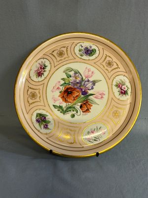 an image of a plate with flowers on it on a table