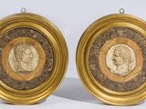 deux portraits encadrés d'or représentant un homme et une femme
