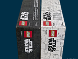 two boxes of lego star wars items on a blue background