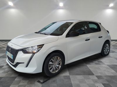 a white car is parked in a room with a checkered floor