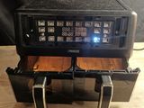 an image of a radio sitting on top of a wooden table