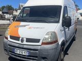 a white and orange van parked in a parking lot