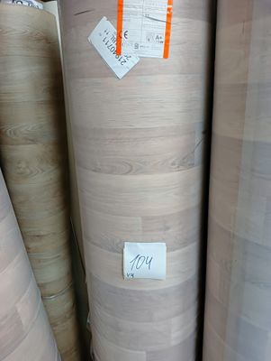 many rolls of wood that are on display in a store