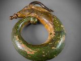 a close up of a sculpture of a snake on a ring