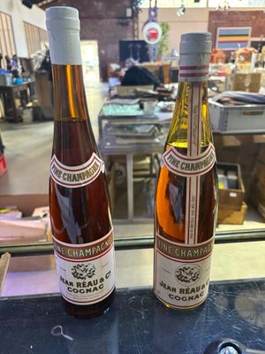 two bottles of wine that are sitting on a table