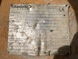 a piece of paper on the ground with writing on it