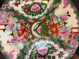 a colorful plate with flowers and birds on it