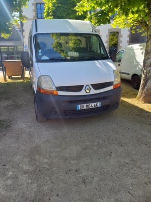 a white van that is parked on the side of the road
