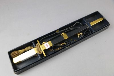 a black box with a knife and a rope in it