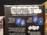 a box of marshmallow test next to a box of marshmallow test