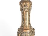 a gold candle that is sitting on a table