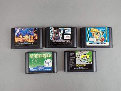 four nintendo game cartridges are lined up on a table