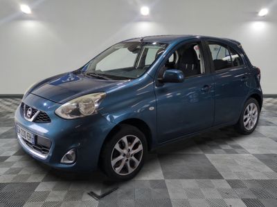 a picture of a blue car parked in a garage