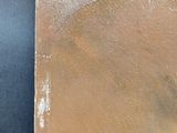 an image of a close up of a painting on a black surface