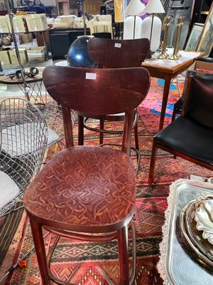 many different types of chairs and tables in this store