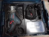 a box with tools in it on a wooden table