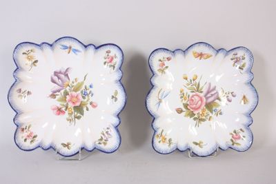 pair of vintage blue and white plates with flowers on them