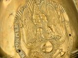 a gold helmet that has a picture of a woman on it
