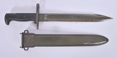 two knives that are laying side by side on a table