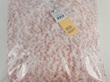 a bag of meat sitting on top of a white table